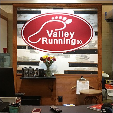Valley Running Service Counter Branding