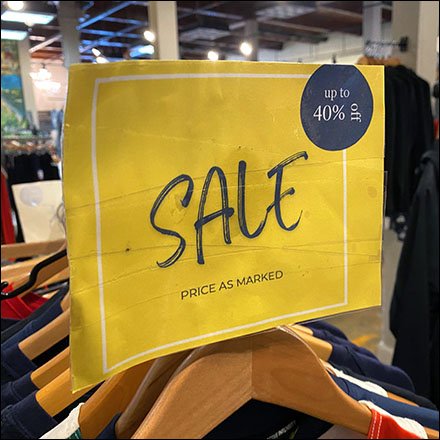 Informal Clothing Rack Sale Notice Reaches Out