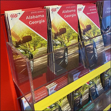 AAA Maps & Tourbook Encyclopedia Fills A Wall Rack
