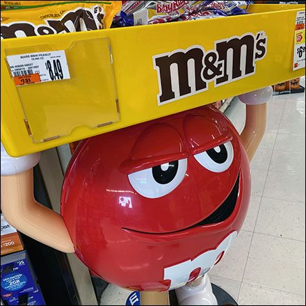 M&M's Red Weightlifter Display Hefts Its Load Overhead