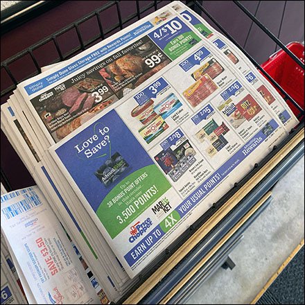 Three-Tier Open-Wire Newspaper Rack Hosts Sales Flyers