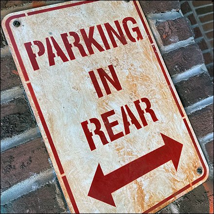 Store Parking In Rear Mall Cryptic Directional Sign