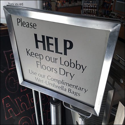 Spy Museum Umbrella Help Lobby Sign Warning