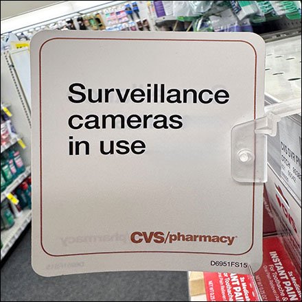 Surveillance Cameras Use Reminder Sign Rides Shelf Edge
