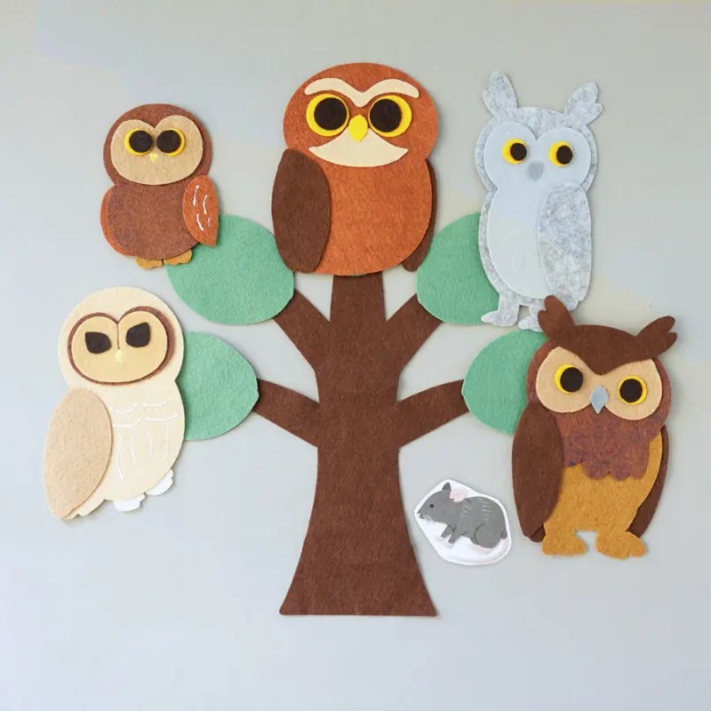 Five felt board owls perched in a tree with a laminated mouse