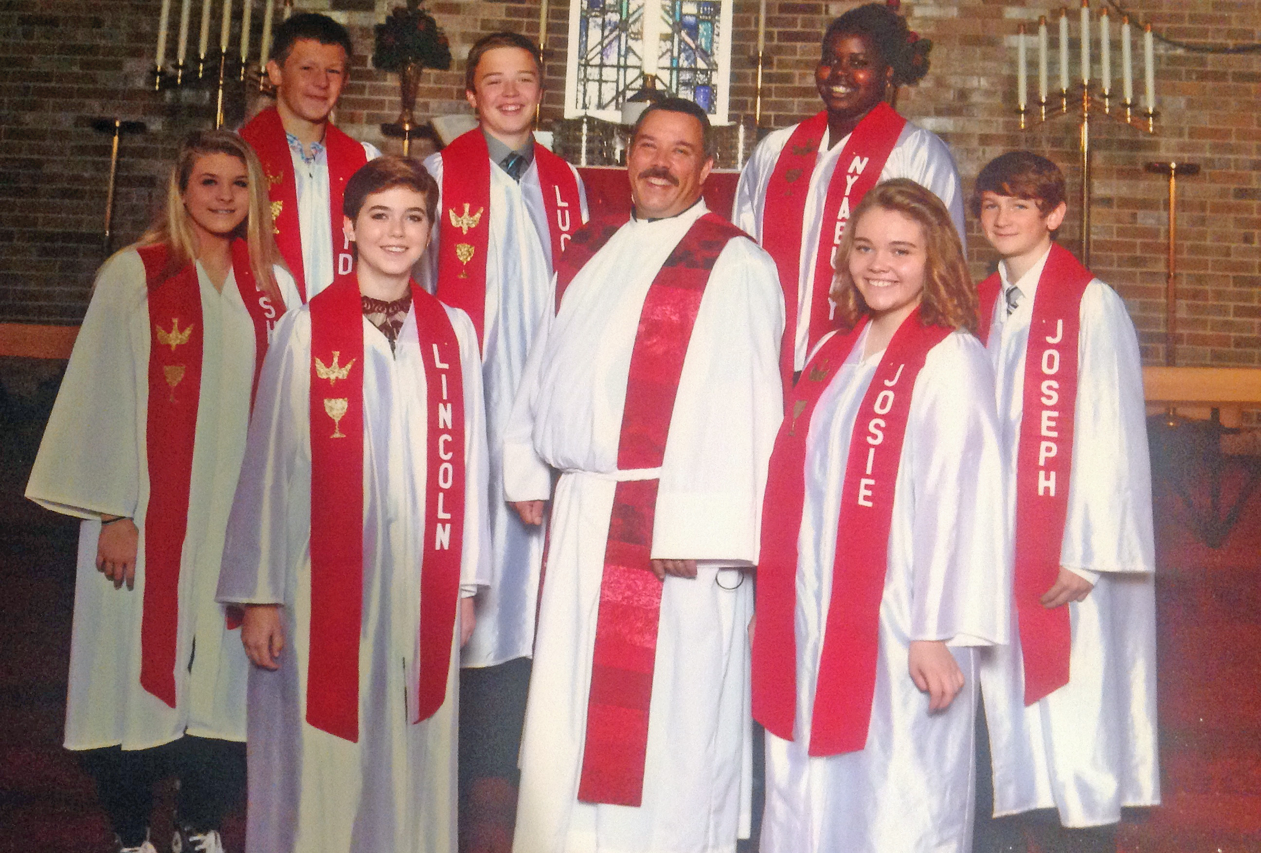 2016 1st row: Ashley Kleider, Lincoln Rahn, Pastor Douglas Dill, Josie Geveshausen, Joseph Graves 2nd row: Jayden Grove, Lucas Leiting, Nyabuay Diew ©Bobier Studio