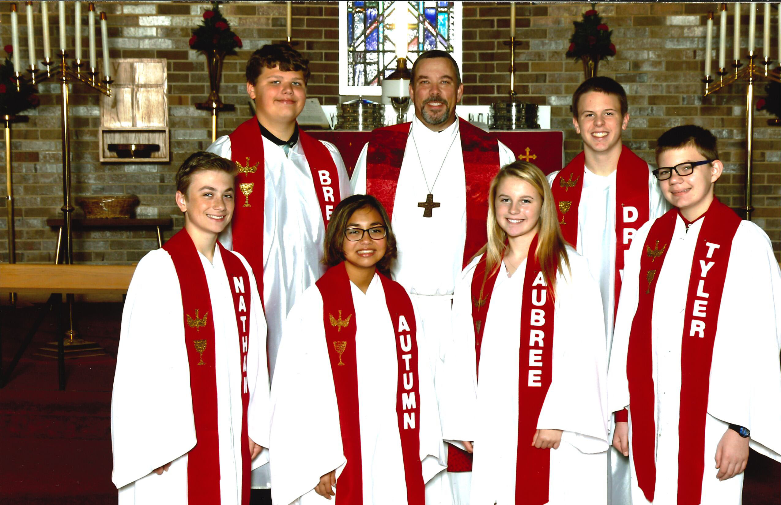 2018 1st row: Nathan Feenstra, Autumn Phommavong, Aubree Van Berkum, Tyler Fader 2nd row: Breck Swanson, Pastor Douglas Dill, Drew Benson. Not pictured: Michael Sigsbee ©Bobier Studio