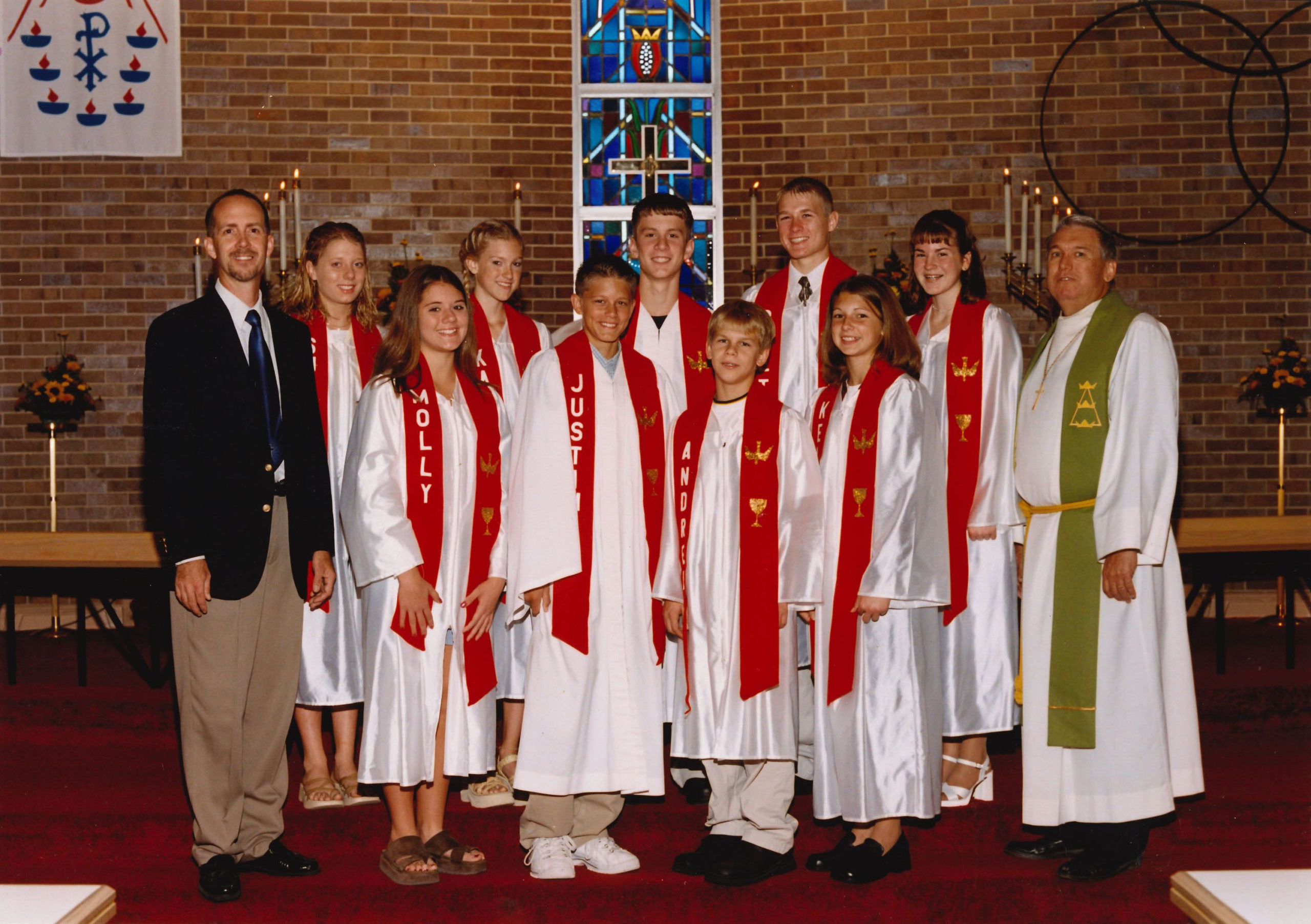 2002 1st row: Molly Zastrow, Justin Bleil, Andrew (AJ) Mittleider, Kelsey Kander 2nd row: Burt Heithold, Suzanne Ostendorf, Kayla Small, Brett Kay, Brett Gotch, Amanda Foxhoven, Pastor Dale Jirousek. Not pictured: Nathan Jepsen ©Bobier Studio