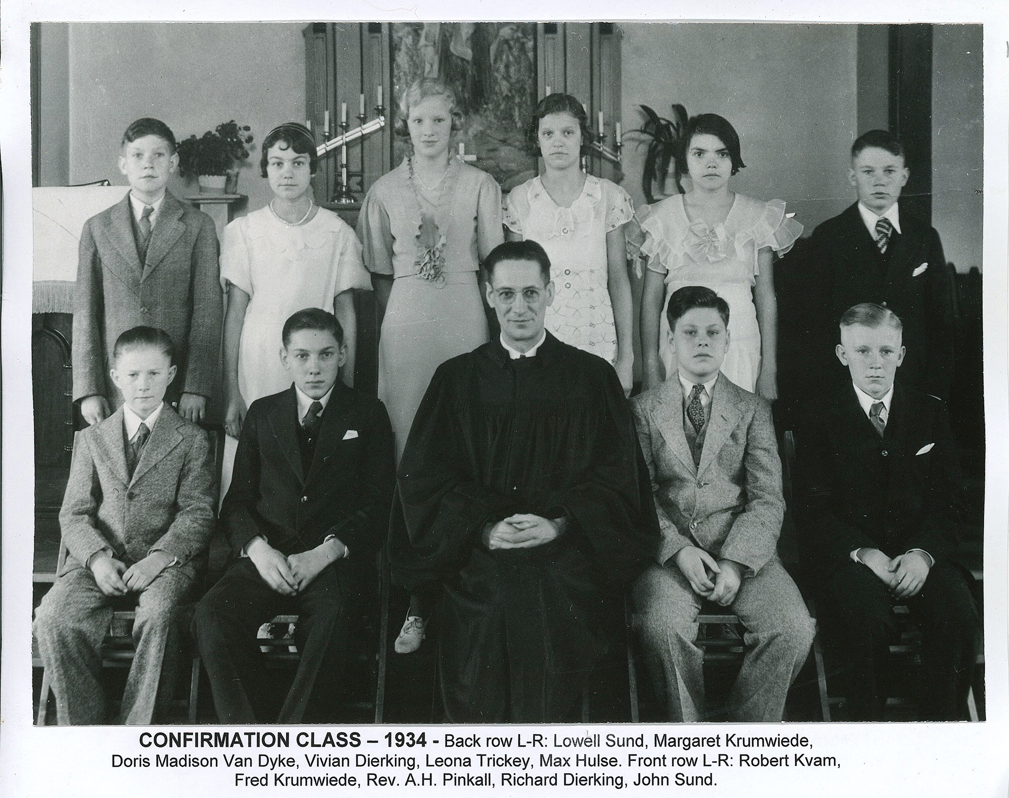 1934 Confirmation Front Row Robert Kvam, Fred Krumwiede, Rev. A.H. Pinkhall, Richard Dierking, John Sund Back Row Lowell Sund, Margaret Krumeiede, Doris Madison Van Dyke, Vivian Dierking, Leona Trickey, Max Hulse