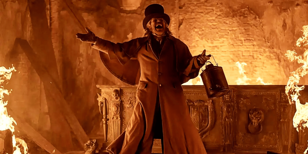 Professor Von Franz (Dafoe) yells after lighting fire in the Harding mausoleum.