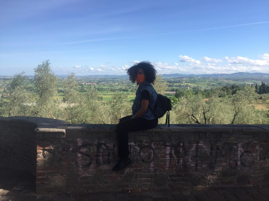 A woman sitting on a wall