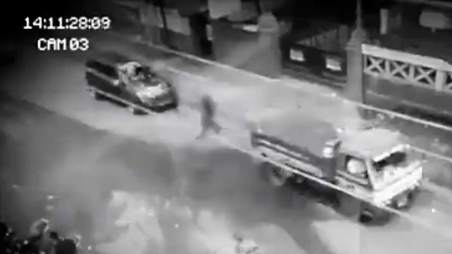Shadow Person Passes Through Cars On Camera