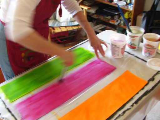 Susan gets down to painting the third and last piece