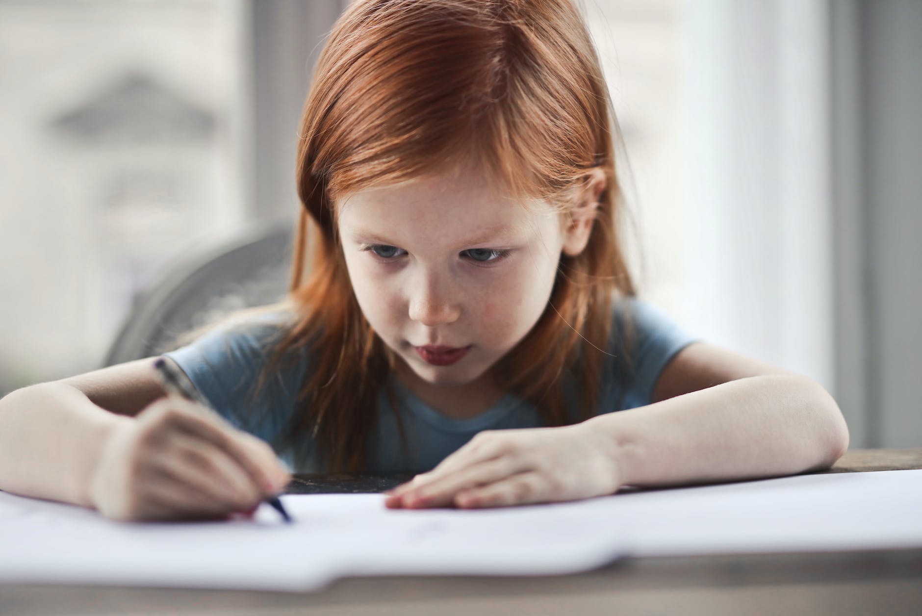 11 Plus Exam Success: How 11 Plus Creative Writing Can Give Your Child an Edge Joycellyn Akuffo girl writing on paper