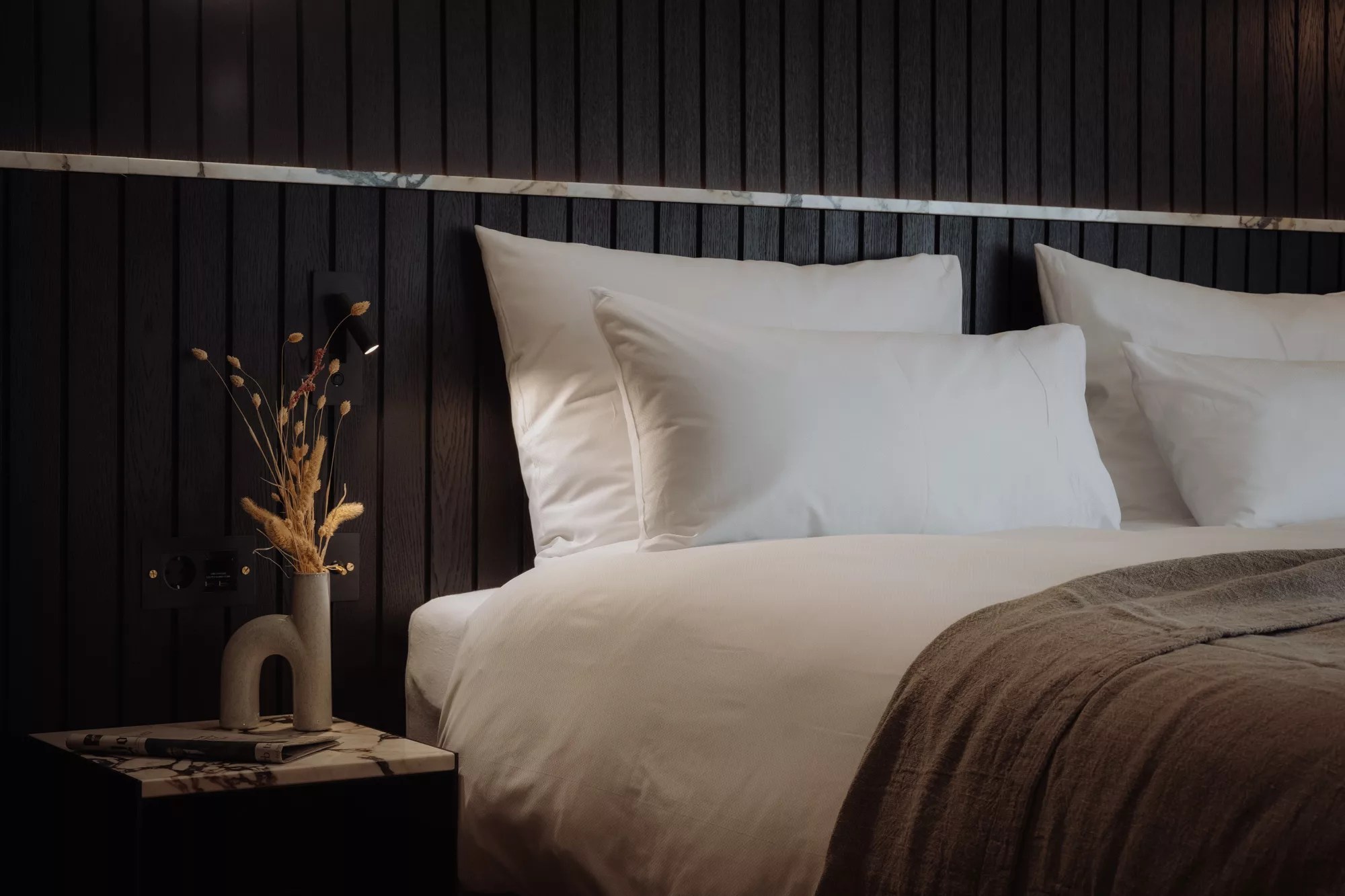 Discover plush pillows in the family room at Gentle Hide, ensuring comfort and relaxation in a serene and inviting environment.