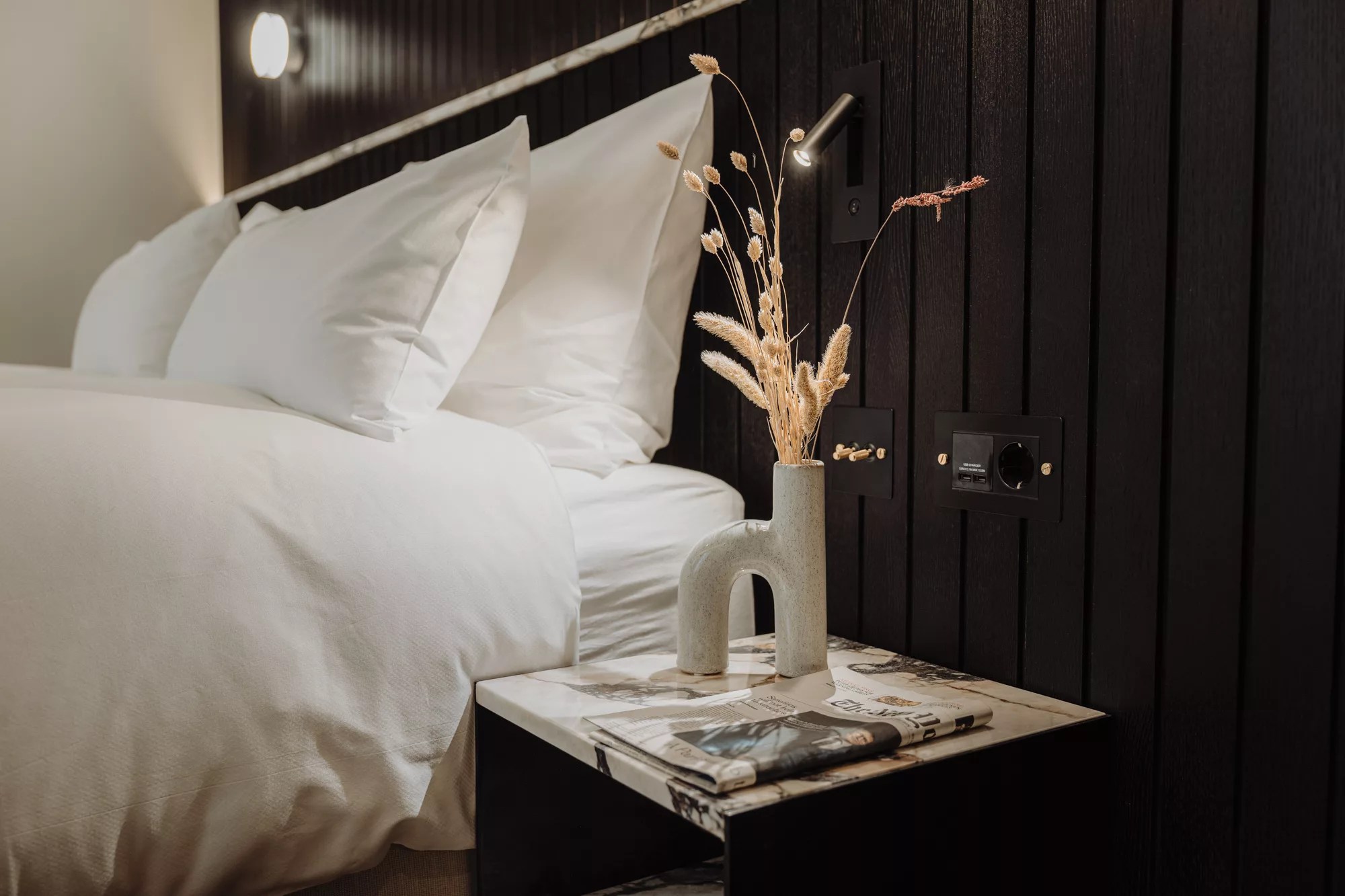 beautiful decorative details such as vase and dried flowers on marble table