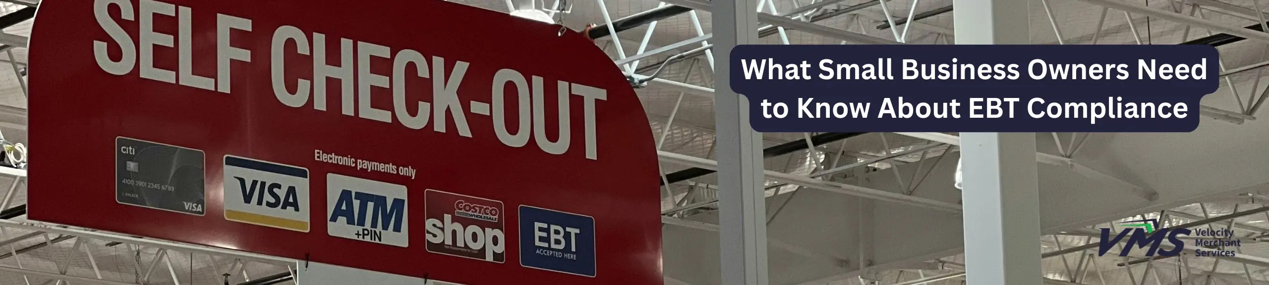 Red self-checkout sign in a grocery store with payment logos including Visa, ATM, and EBT accepted.