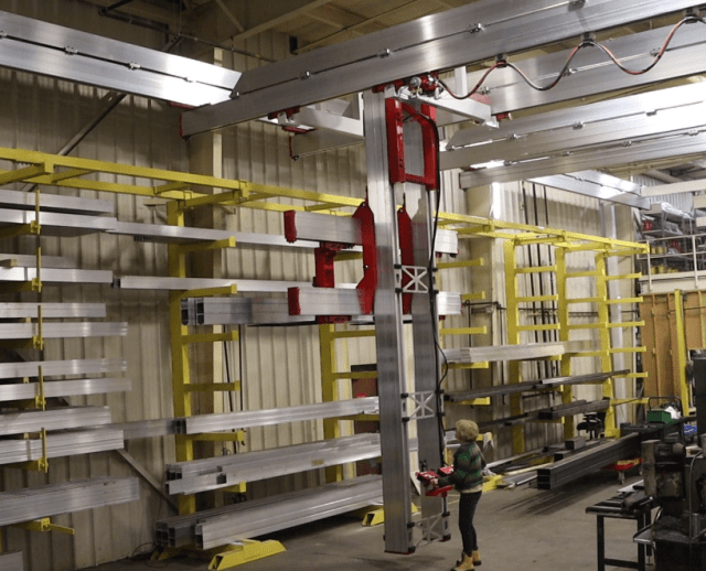 An operator controlled stacker crane