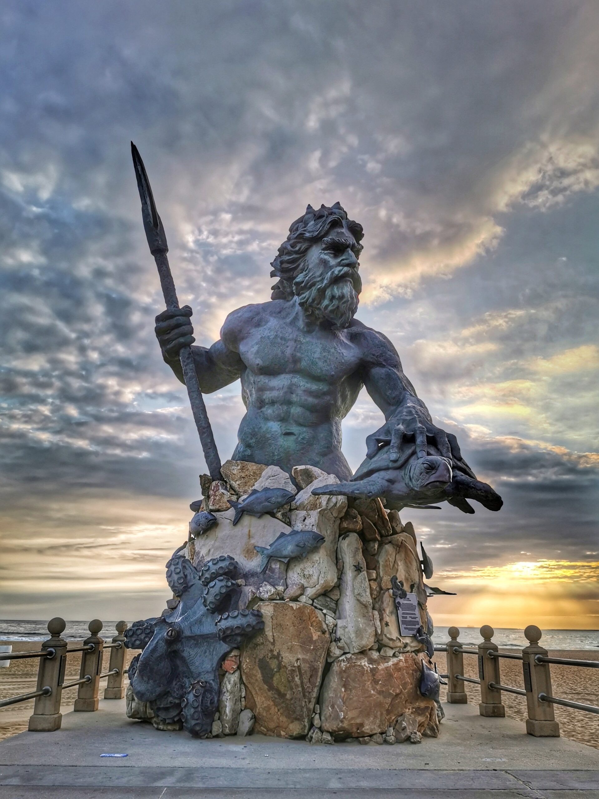 King Neptune statue on Virginia Beach at sunrise Goat Roti Chronicles