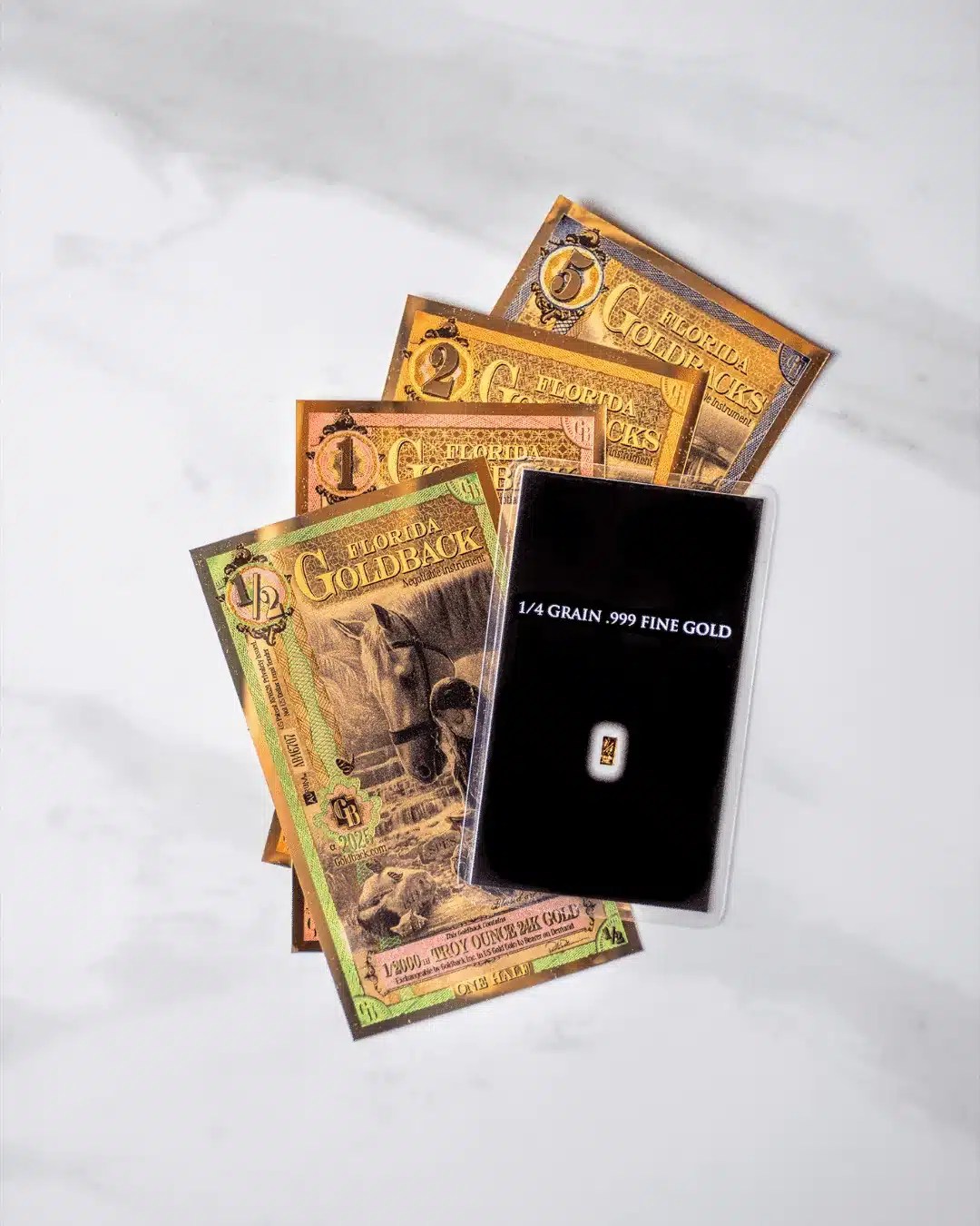 Fractional gold formats side by side, showing the difference in physical size