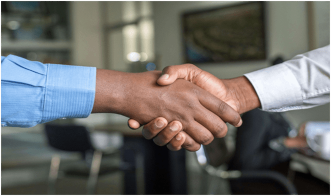An image of two people shaking hands.