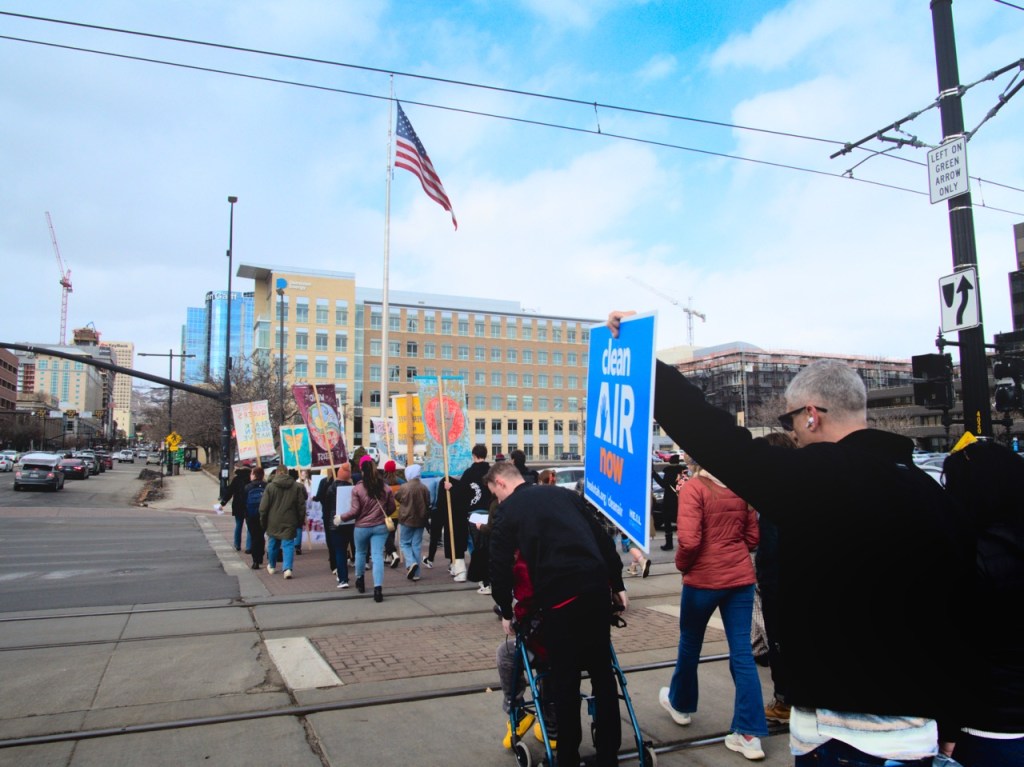 Image of protesters with HEAL Utahs Clean Air Now signs by TrentPow