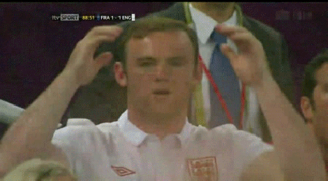 Wayne Rooney makes sure his hair plugs fit at Euro 2012.