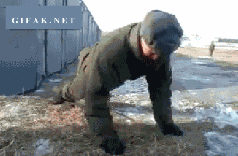Russian soldier does no-handed push-ups.