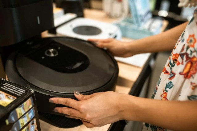 person holding black vinyl record