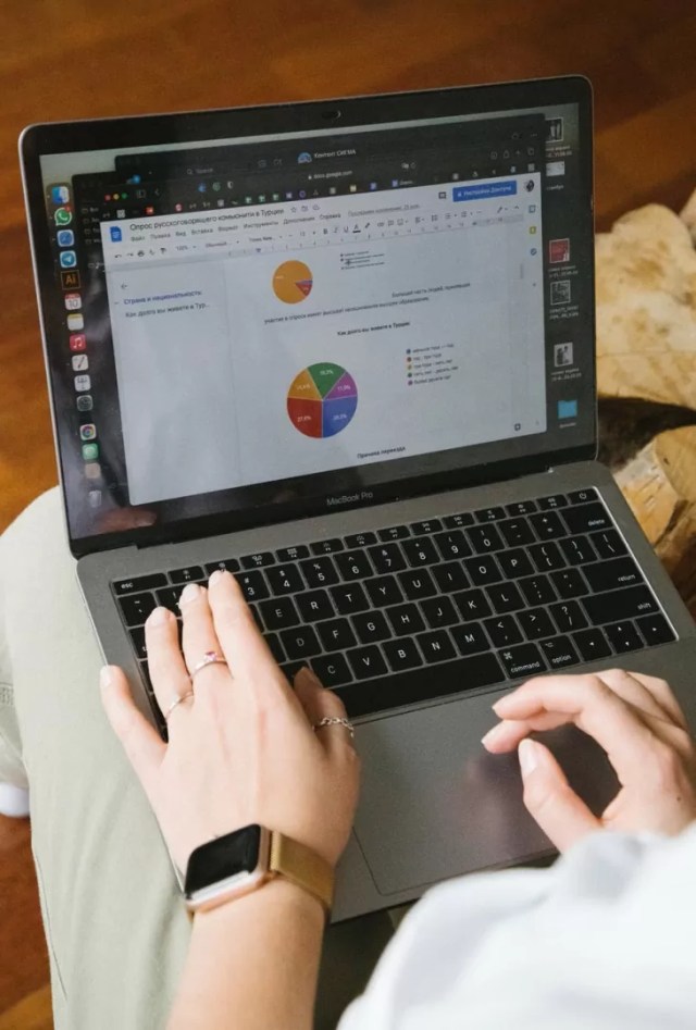 crop unrecognizable person working on laptop