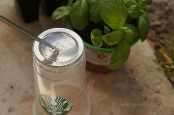 How to make Starbucks Cup Planters - cut hole on the bottom