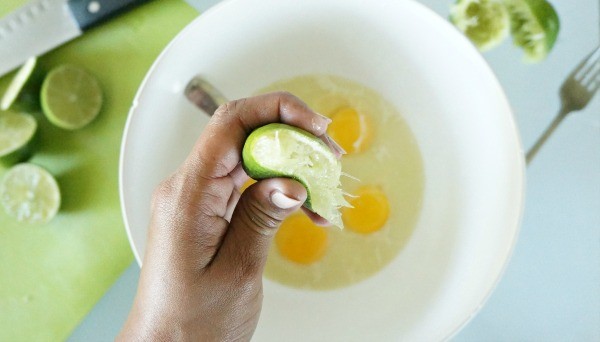 How to make the best key lime bars, squeezing in fresh lime juice