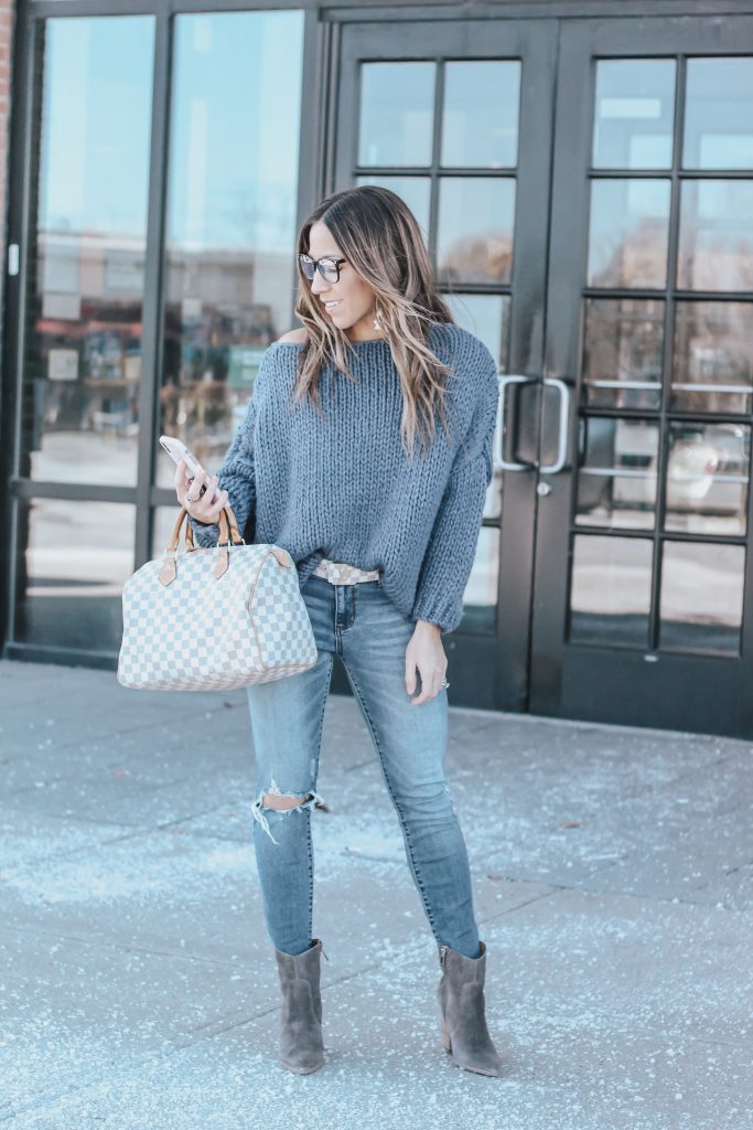 Spring Booties featured by top US fashion blog House of Leo Blog; Image of a woman wearing Chicwish sweater, Marc Fisher boots and Nordstrom jeans.