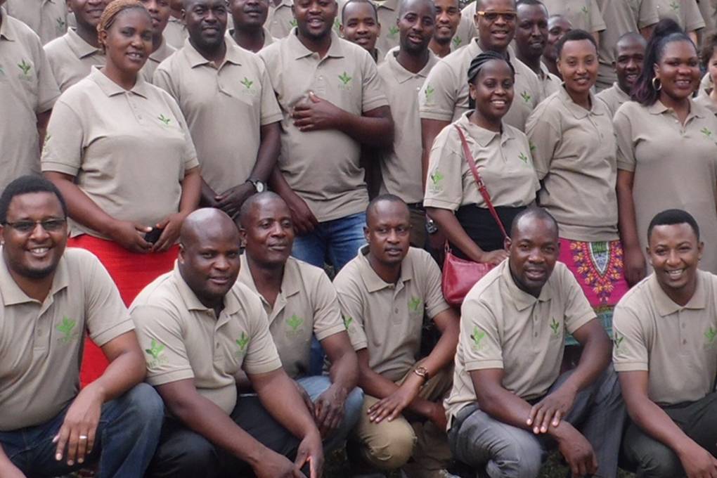 people in branded polo shirts