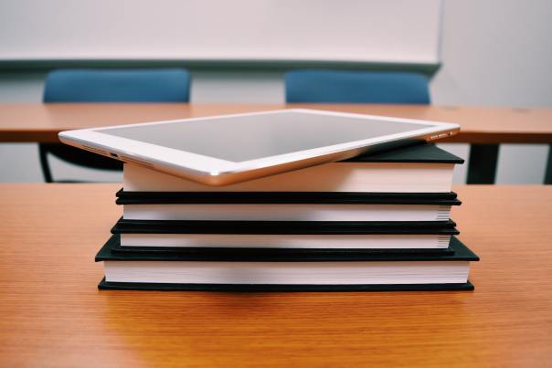 iPad on stack of books