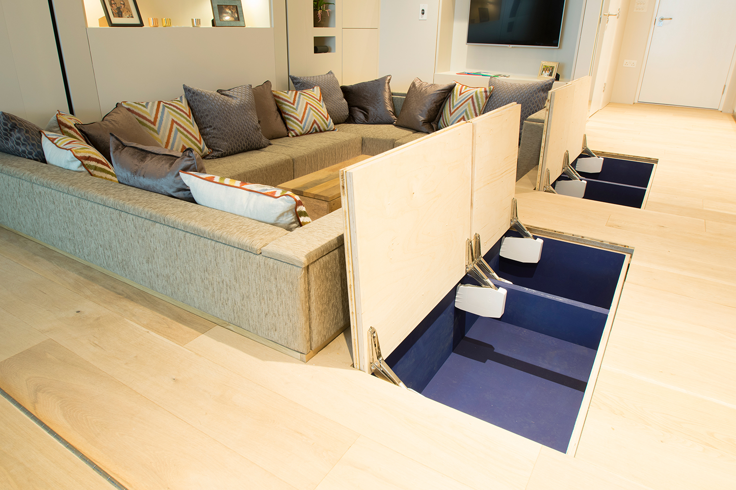 Modular studio apartment with elevator bed and disappearing dining table