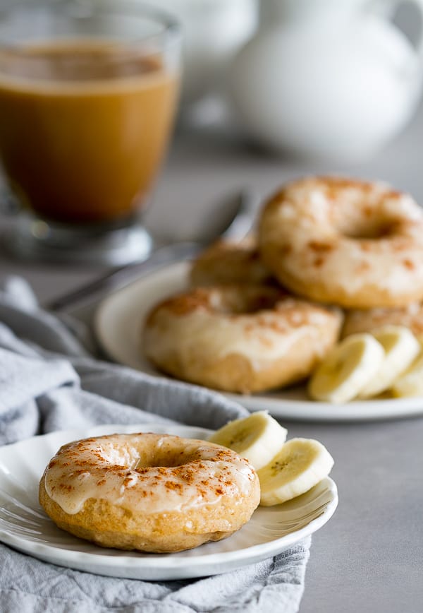 Baked Banana Donuts with powdered sugar glaze and a sprinkle of cinnamon