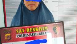 Polisi tahan Ibu Rumah Tangga sebagai terduga pelaku penipuan 57 warga Aceh Besar dengan modus dapat rumah bantuan