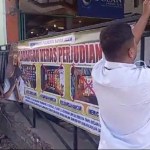 Satreskrim Polresta Banda Aceh memasang spanduk imbauan larangan judi online di warung kopi dalam wilayah hukumnya, Rabu (26/6/2024). (Foto: Dok. Polresta Banda Aceh)