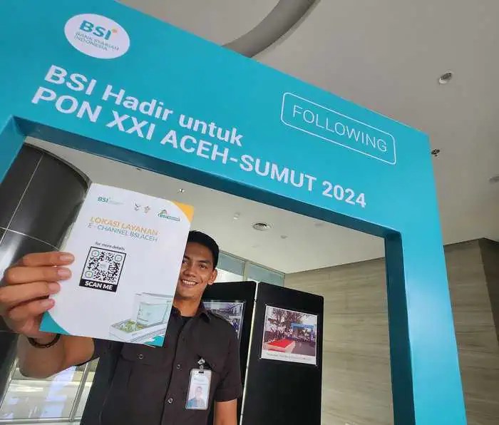 BSI Aceh meluncurkan flyer informasi lokasi layanan e-channel BSI untuk PON XXI/2024 yang diselenggarakan di Aceh. Foto: For Infoaceh.net