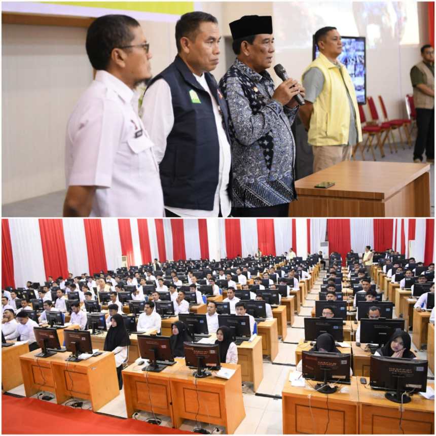 Plt Sekda Aceh Muhammad Diwarsyah didampingi Kepala BKA Abdul Qahar meninjau dan memberi semangat kepada peserta tes CPNS, yang akan mengikuti tes CAT, di Aula BPSDM Aceh, Jum'at (18/10)