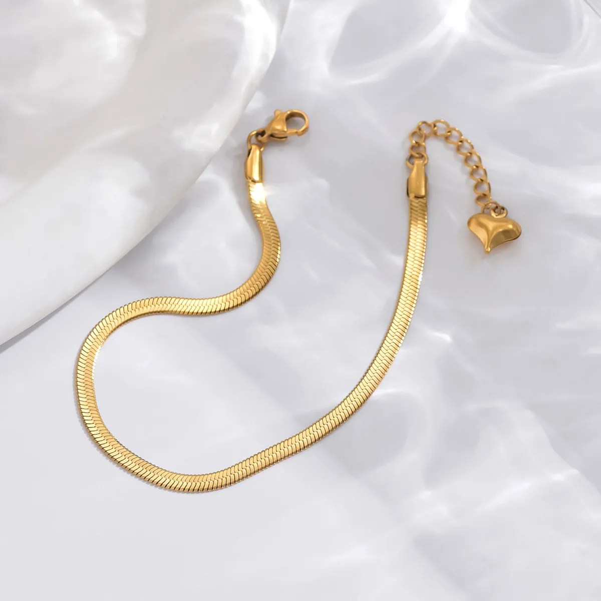 Gold snake chain bracelet in flat herringbone style, waterproof and anti-tarnish
