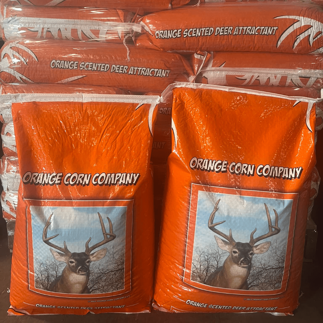 Orange bags of Orange Corn Company Deer Feed
