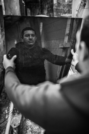 photo of man holding mirror