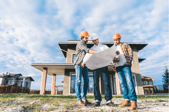 Home builders cheking blueprint