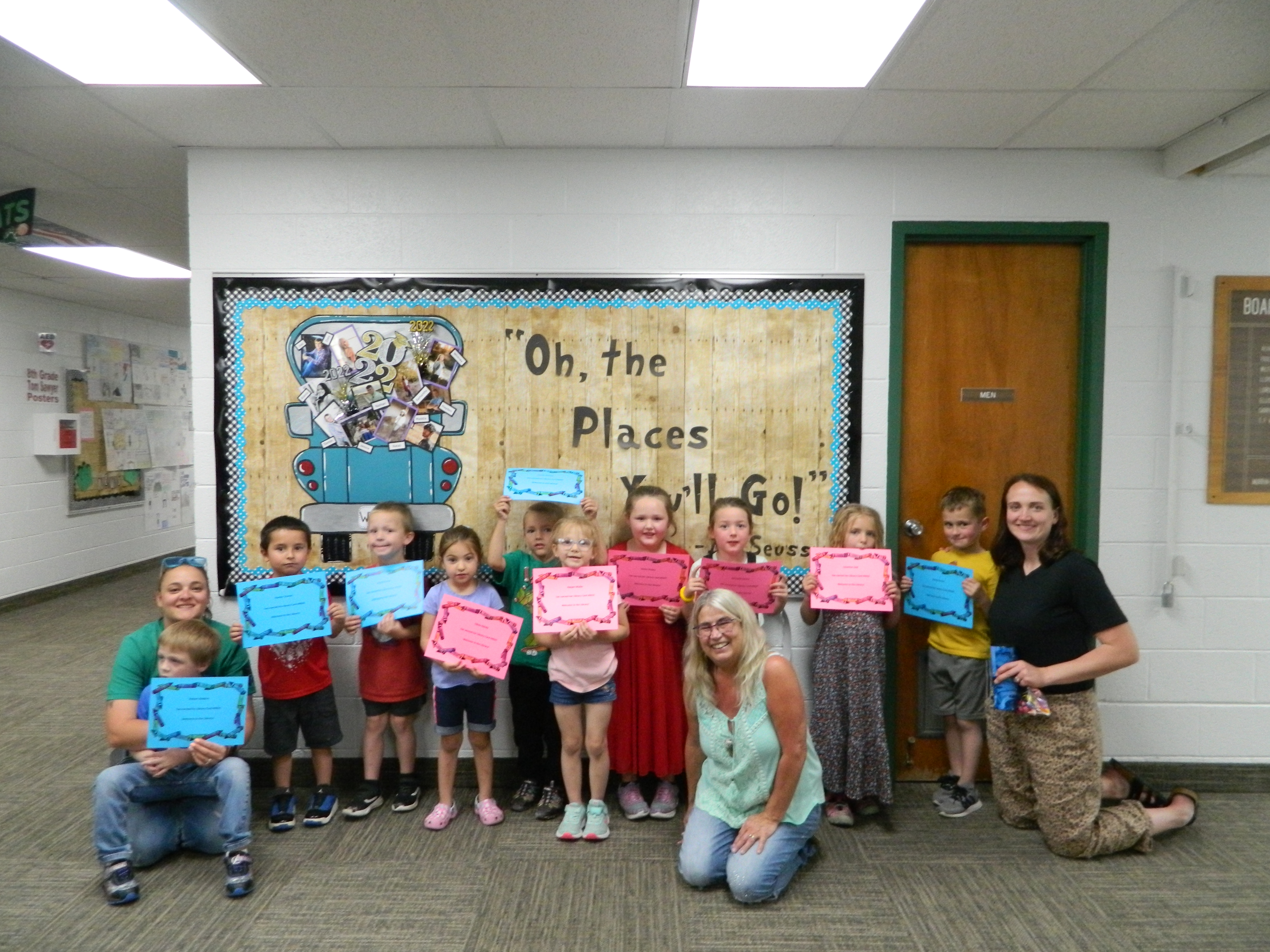 Members of Fleming Elementary School's afternoon preschool class who will be moving on to kindergarten next school year hold  a certificate with their library card number on it. Left to right; Preschool Aide Alex Bandy, Robby Robbins, Xander Chavez, Breck Harms, Olivia Bandy, Jimmie Herring, Harper Muller, Kinley Hicky, Kennedy Landry, Leonnise Lind, Grady Grove and Preschool Teacher Mrs. Ruff.  The 