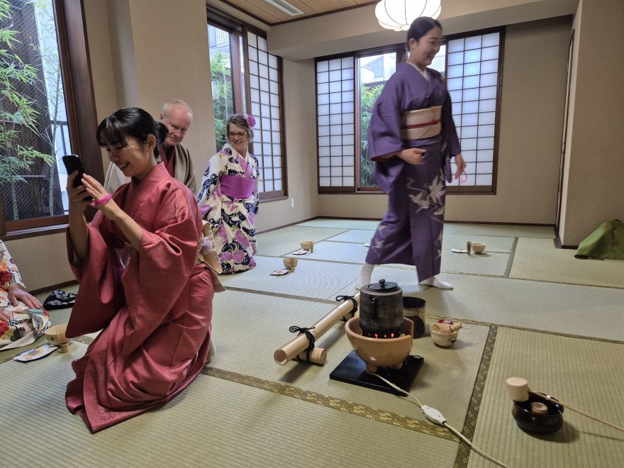 Guests dressed in traditional kimonos enjoying a serene tea ceremony at Maikoya, Tokyo.