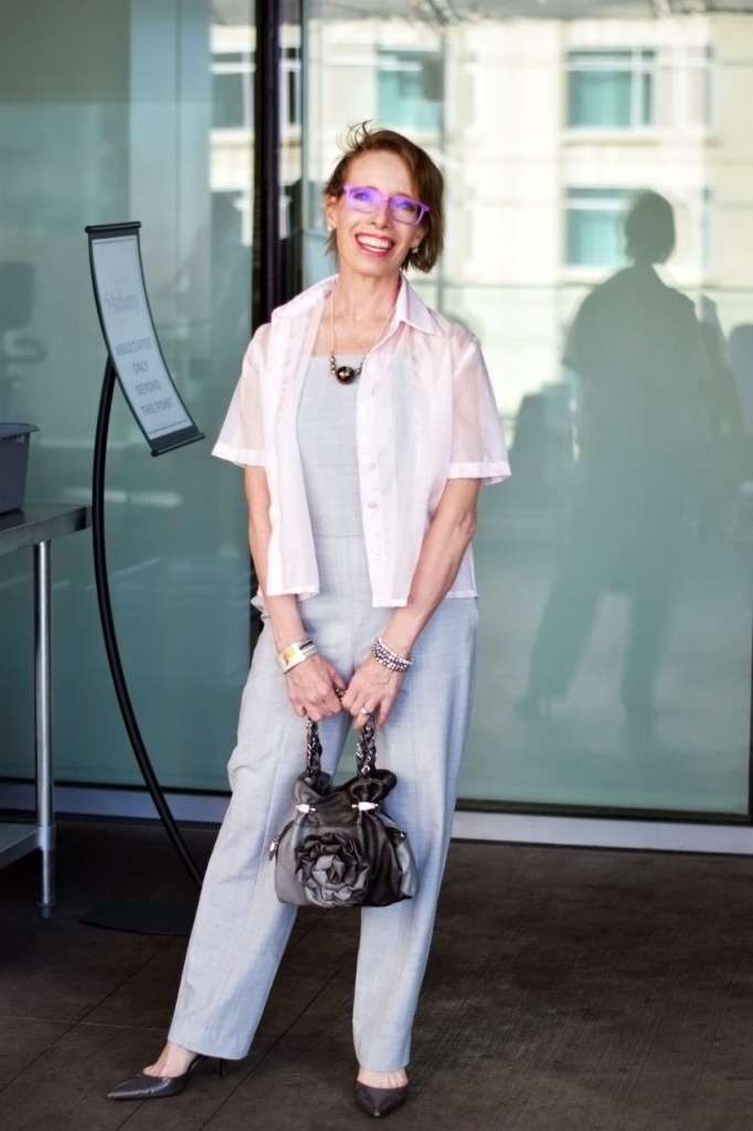 wearing a sheer pink top for women over 50