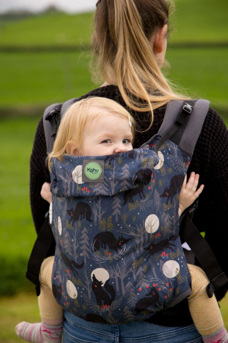 KahuBaby carrier in Forest Whisper print, shown in the back carry position