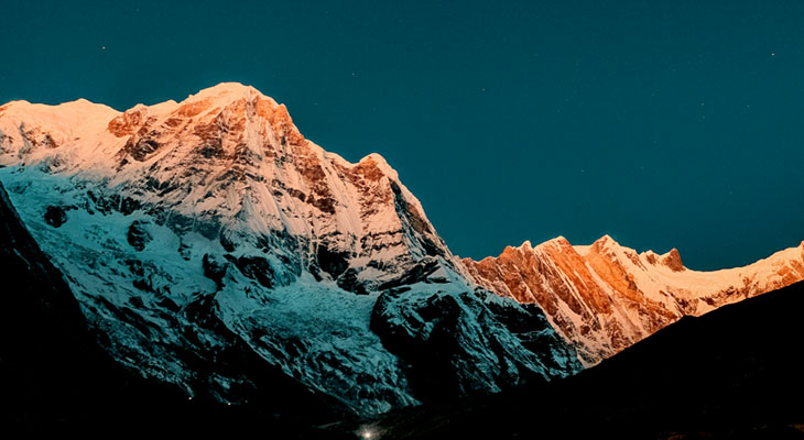 The golden sunlight on the Annapurna mountain range